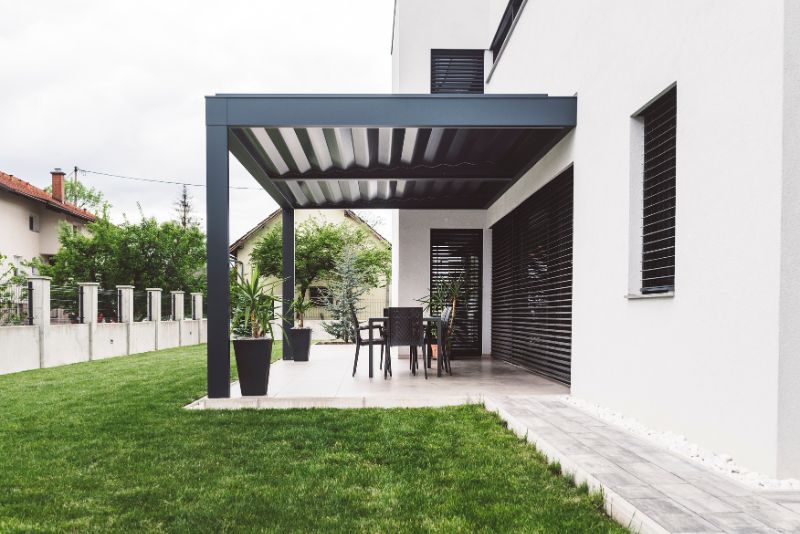An enclosed concrete patio on a home